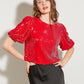 TOP ROUGE À SEQUINS