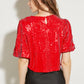 TOP ROUGE À SEQUINS