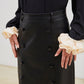 JUPE EN SIMILI CUIR A BOUTONS
